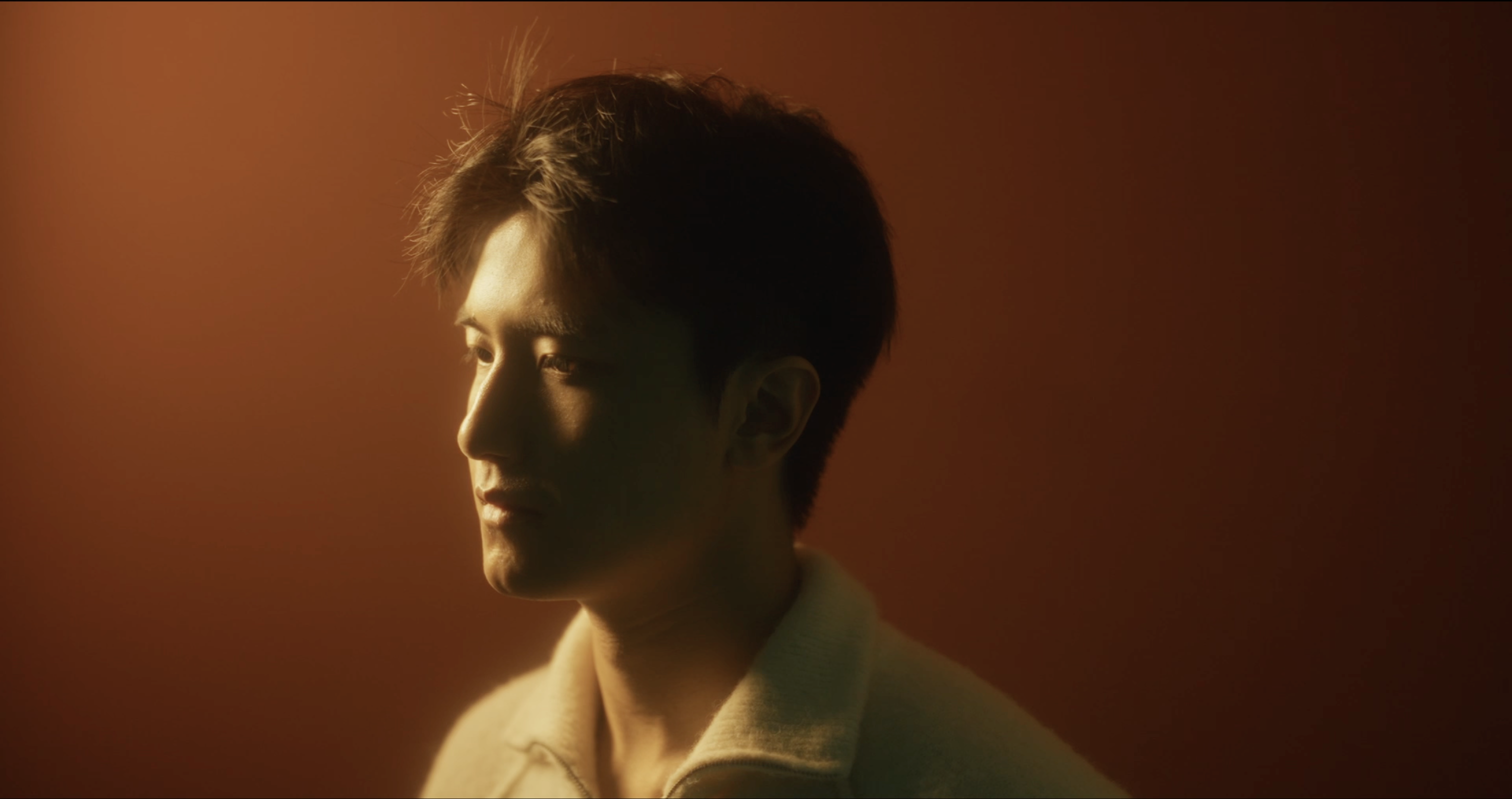 Warm close-up Inner Space still of Jerry Pan looking to the side