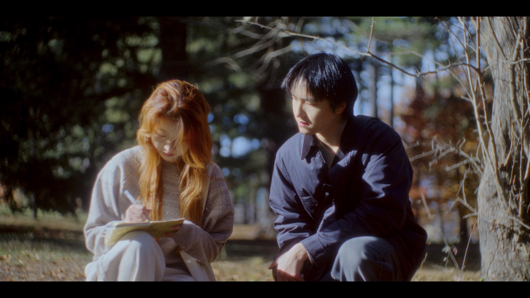 Myosotis still with Xin and Lily sitting together outdoors