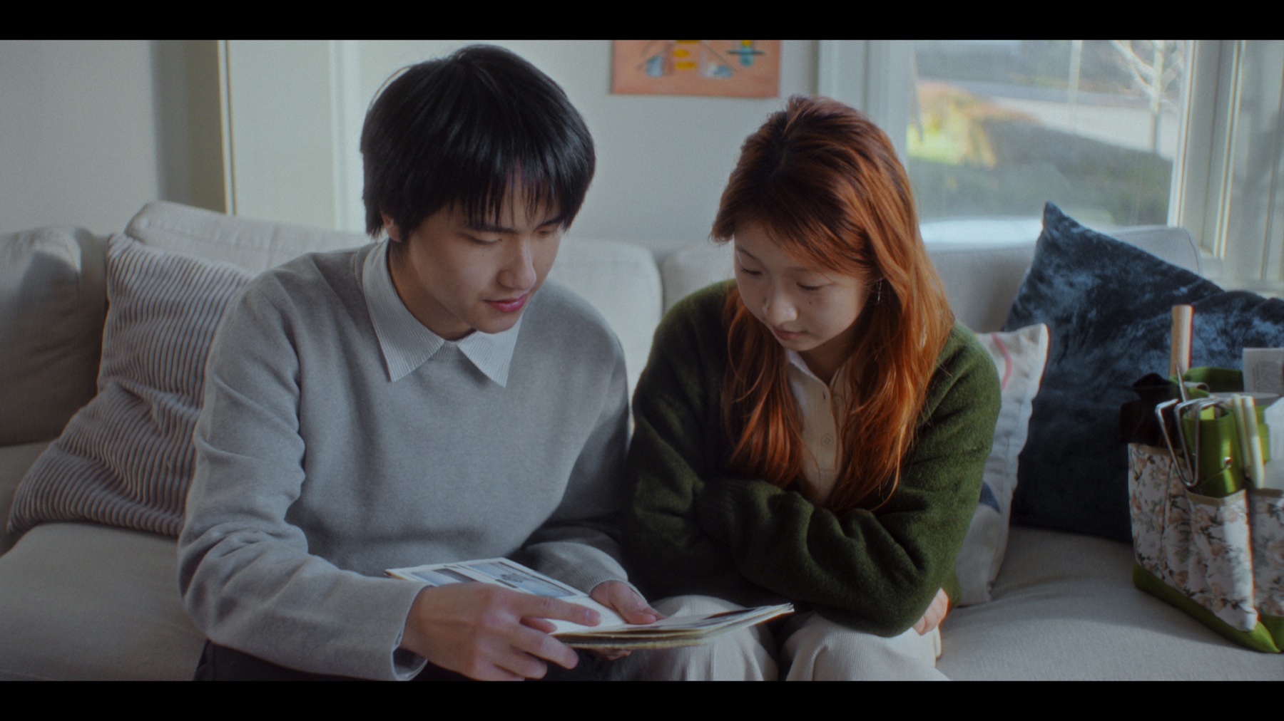 Myosotis title still with Xin and Lily walking through a park