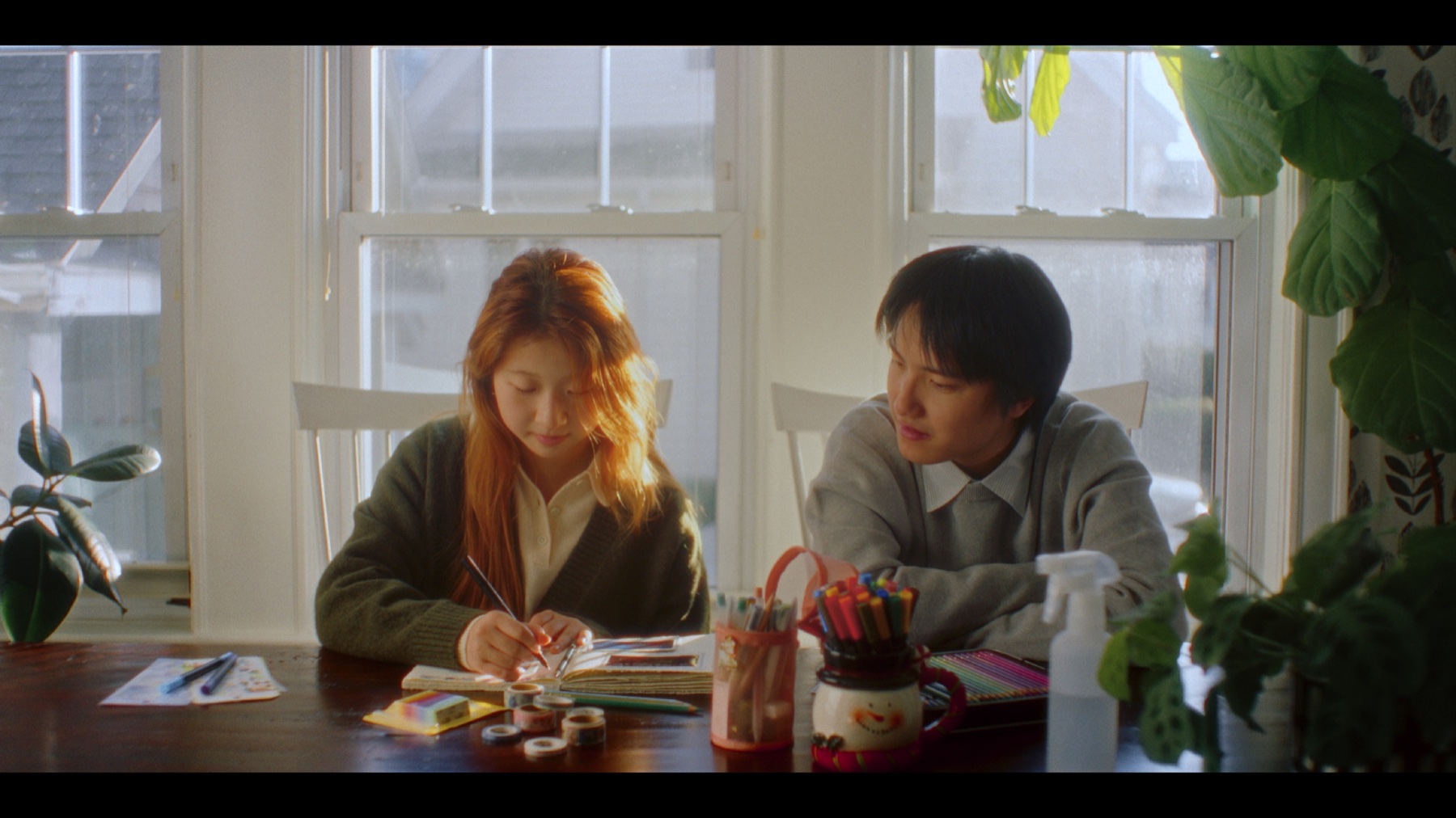 Myosotis behind-the-scenes photo at a table with cast and crew